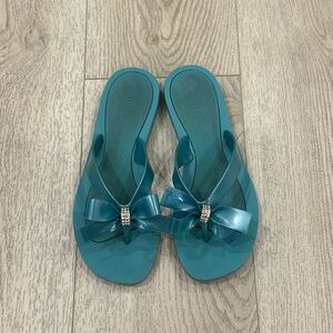 Guess turquoise bow flip flops